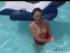 Sexy chick with cute dimples stripping down in the pool